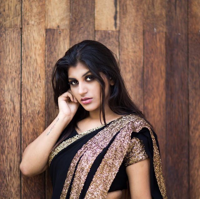 Yaashika Anand radiates heat and elegance in a stunning saree photoshoot, showcasing beauty and confidence.