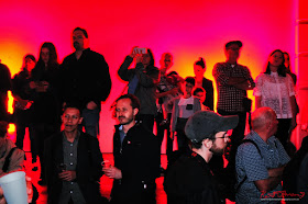 HeadOn Photo Festival launch in Paddington Sydney - Crowd portrait in deep red lighting reminiscent of being in a black and white print processing darkroom. Photo by Kent Johnson for Street Fashion Sydney.
