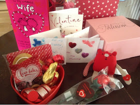 range of valentine's themed items including chocolates, cards, soft toy and handmade cards.