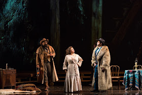 IN PERFORMANCE: (from left to right) Bass-baritone JASON S. MCKINNEY as Ashby, soprano KRISTIN SAMPSON as Minnie, and baritone ALEKSEY BOGDANOV as Jack Rance in Opera Carolina's production of Giacomo Puccini's LA FANCIULLA DEL WEST, April 2017 [Photo by Mitchell Kearney, © by Opera Carolina]