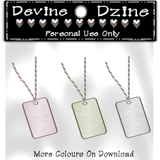 http://devinedzines.blogspot.com/2009/05/metal-tags-png-freebie.html