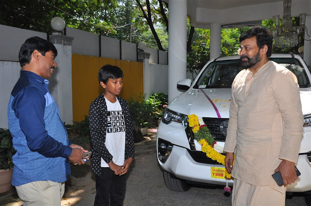 Megastar Chiranjeevi & Suresh Kondeti with his New Fortuner Car Pooja Pic