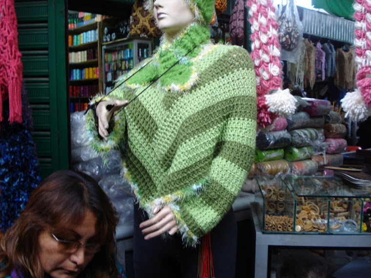 PONCHO CON MANGAS