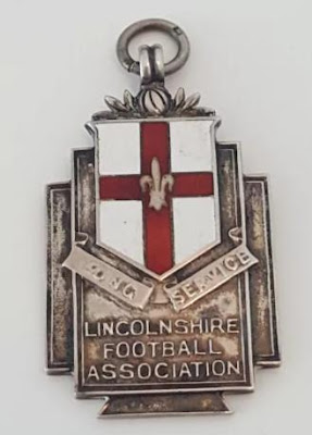 Picture two of football medal awarded to a Brigg official in 1923