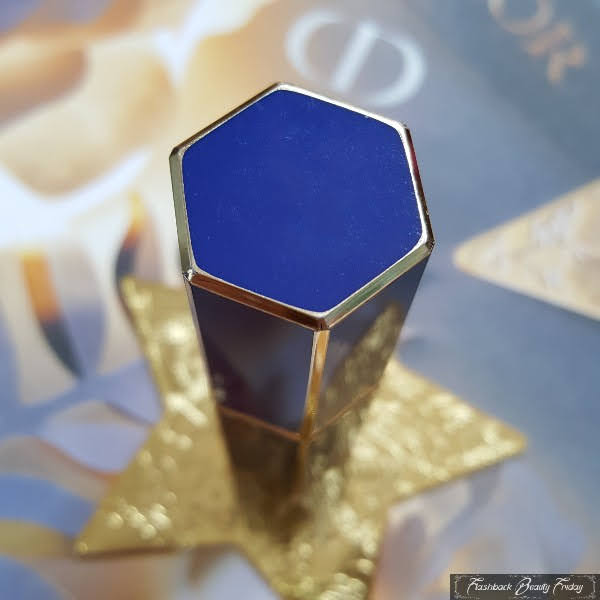 hexagonal top of blue Dior lipstick case with gold trim