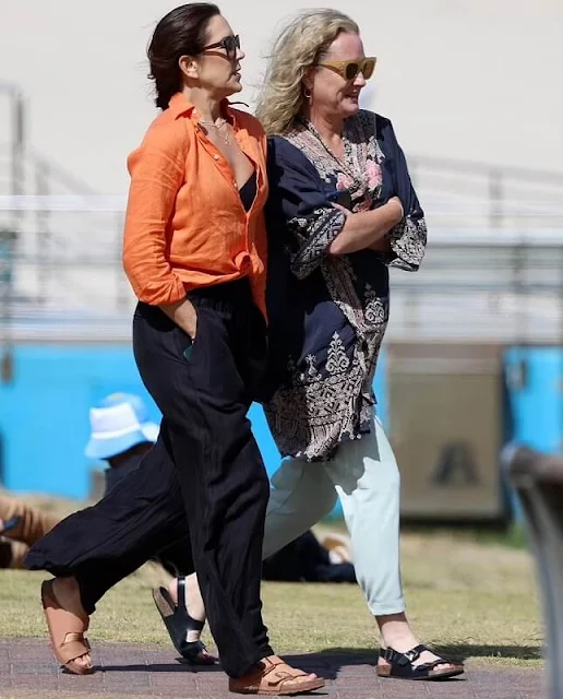 Crown Princess Mary wore an orange relaxed fit linen shirt by Polo Ralph Lauren. Birkenstock Arizona Vegan sandals