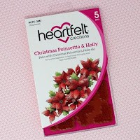 https://www.heartfeltcreations.us/product-collections/candlelit-christmas/christmas-poinsettia-holly-cling-stamp-set