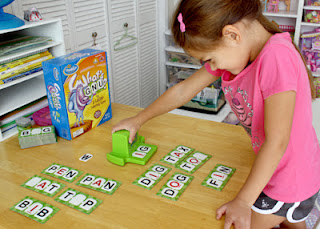 Tessa slid the Letter Getter to reveal our next two letter tiles. I made the word "TIP" with the letter "I" tile.