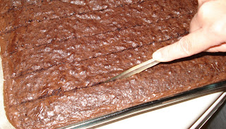 Cutting brownies with plastic knife