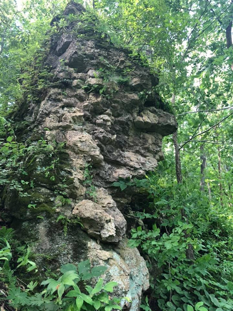 Rock formations awe while weaving through the trails of Mississippi Palisades State Park.