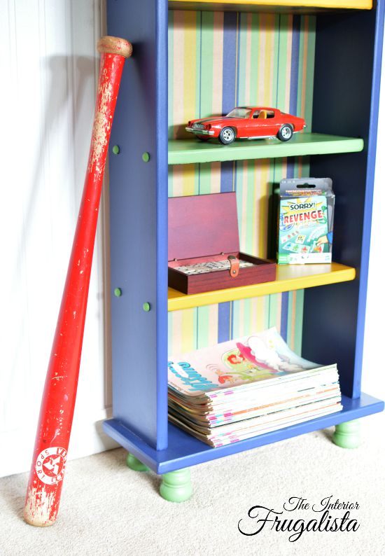 Wooden screw plugs on the side of small bookcase painted a contrasting color