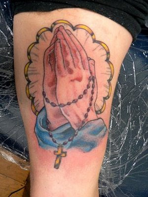 Our old friend the rosary cross is our next tattoo on ankle design and man