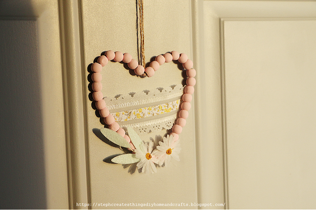 Hanging beaded heart decoration