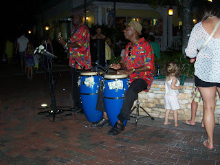 Street Musicians play on the boardwalk at Atlantis Harbor outside Bimini Road on Paradise Island in the Bahamas.