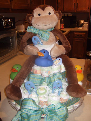 I put a diaper on my topper, just to make everyone laugh well I made myself laugh - who am I kidding! Step 7: Add your embellishments. pacifiers,