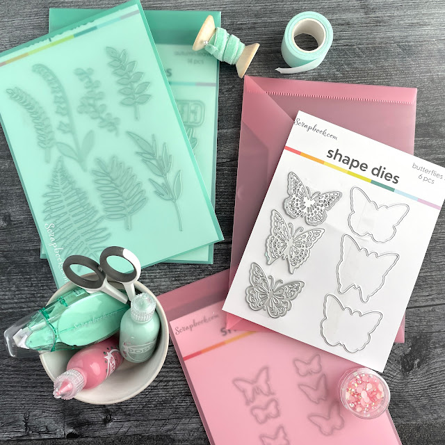 Scrapbook.com storage envelopes in mint and pink; delicate leaves die, butterflies die, small scissors, adhesive and pops of color