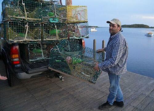 Lobsterman Tucker Soule unloads a trap at Cape Porpoise near Kennebunkport, Maine, on May 23, 2022.
