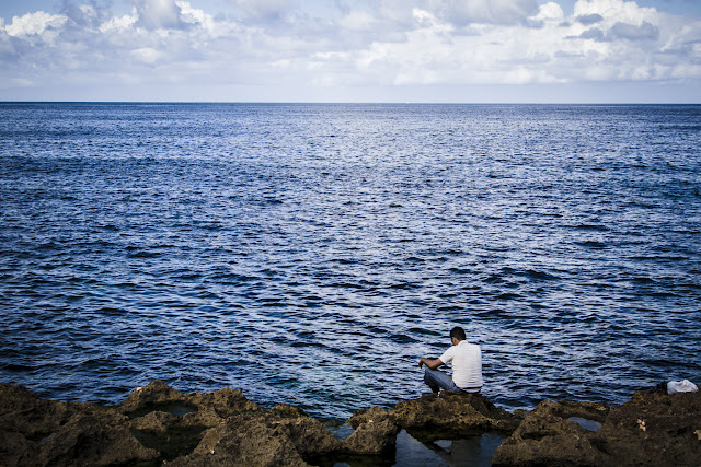 Cuban looking at the sea in Havana, Cuba