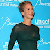 Hollywood Hot Uma Thurman gets some oomph in a VERY tight-fitting dress at UNICEF Snowflake Ball