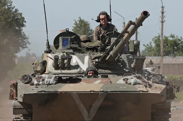 Cover Image Attribute: Service members of pro-Russian troops drive an infantry vehicle during the Ukraine-Russia conflict in the Popasna, Luhansk Region of Ukraine, June 2, 2022. REUTERS/Alexander Ermochenko