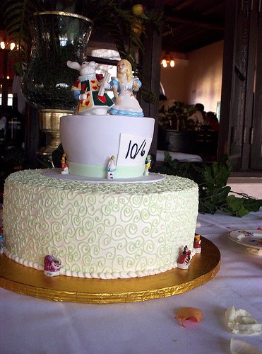 Classic mad hatter white wedding cake with Alice in Wonderland cake topper