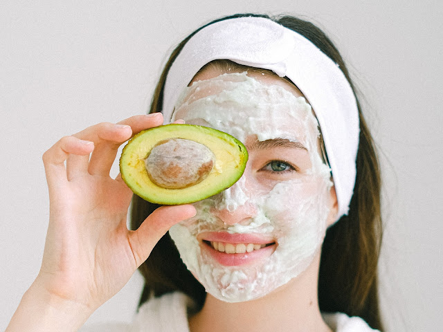 https://www.pexels.com/photo/cheerful-woman-with-mask-and-avocado-5069401/