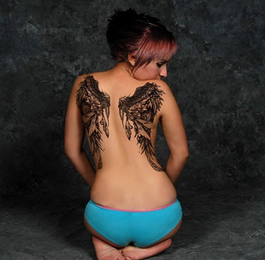  black angel wings on each side starting where the neck tattoo ends my 