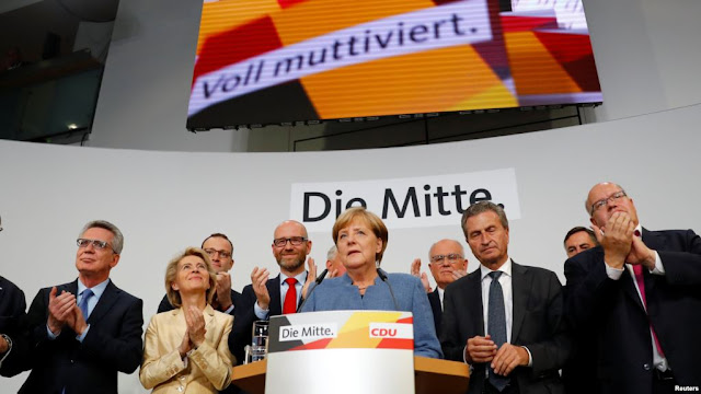 Merkel Wins Historic Fourth Term But Far-right Populists Surge.