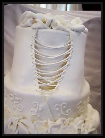 Unique wedding cake in the shape of a wedding dress by Sweetcakes by Sara