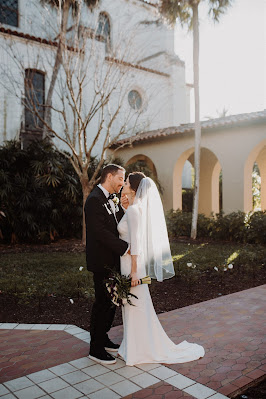 bride and groom kiss outside knowles chapel