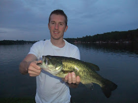 huge largemouth bass at sunset, twilight, shoreline, michigan