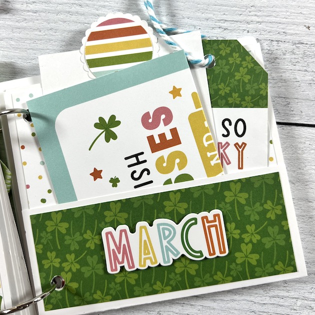Spring St. Patrick's Day Scrapbook Album page with a pocket, shamrocks, and journaling cards