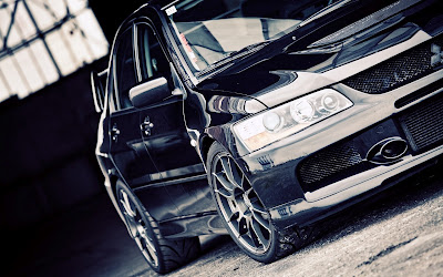 Black Mitsubishi Evolution in Garage HD Car Wallpaper