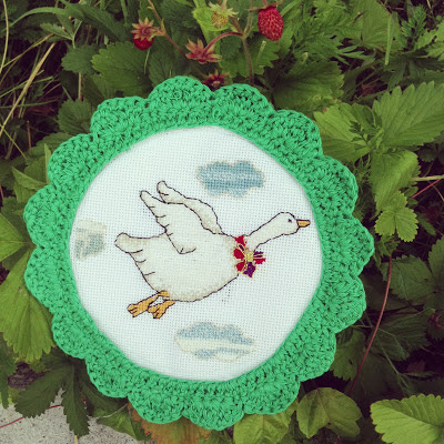 cross stitch flying goose and crocheted frame