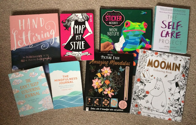 Selection of activity books including hand lettering, a fashion journal, colouring books and a stick by numbers book