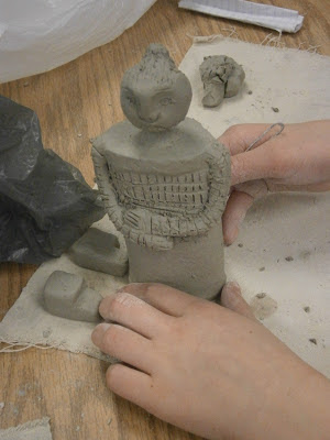 Student building clay warrior for terracotta warrior art lesson