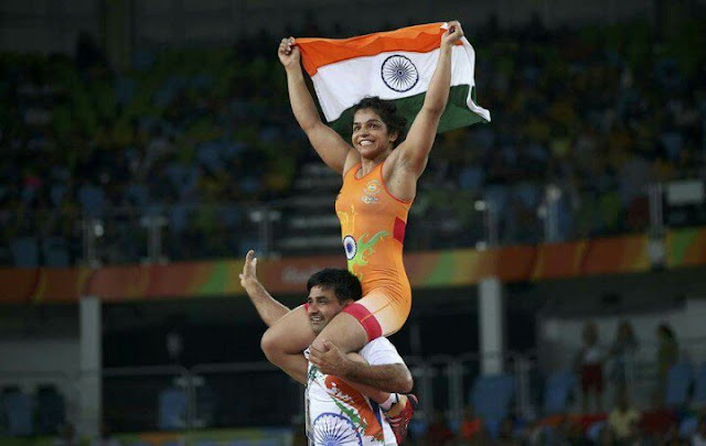 Sakshi Malik First Indian Woman Wrestler Winner Bronze Medal in Olympics Rio 2016 Celebration Indian Flag Medal Rohtak Girl Haryana