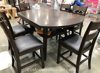 Easily gather for a meal with the family with the Bayside Furnishings 7-piece Counter-Height Round Drop-Leaf Dining Set