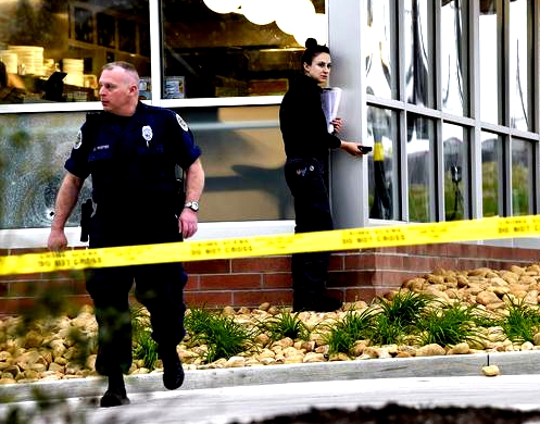 Metro Nashville Police work the scene where four people died after a gunman opened fire at a Waffle House in Antioch early Sunday, April 22, 2018.