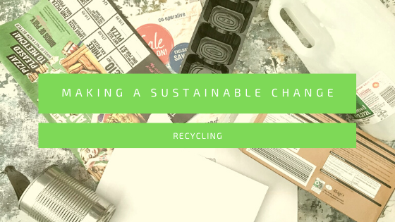 Flatlay showing a mix of waste and empty cartons for recycling with the text, making a sustainable change - recycling across the centre