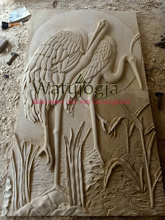 batu ukir motif relief burung