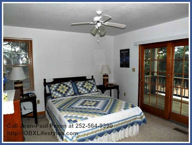 The bedrooms of this secluded home for sale in Corolla NC are connected to the patio. 