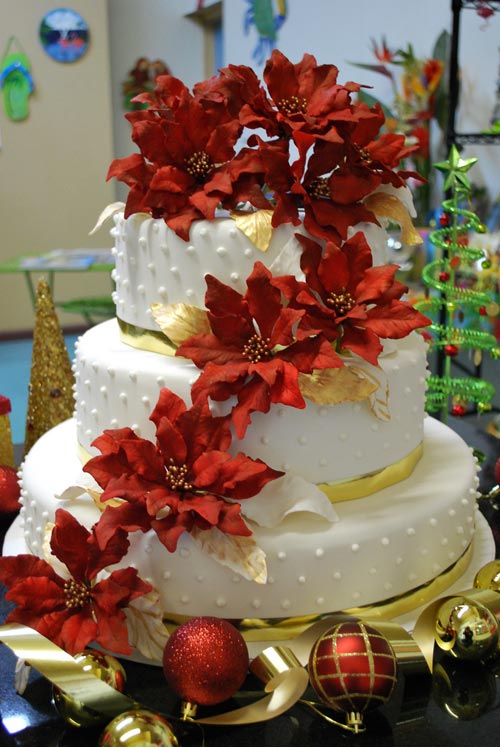 Huge five tier Christmas winter wedding cake with Santa and two of his 