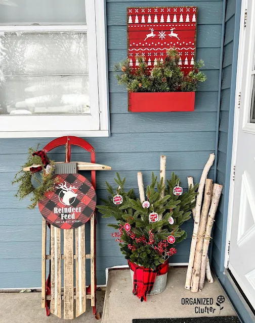 Photo of a covered porch step decorated for Christmas.