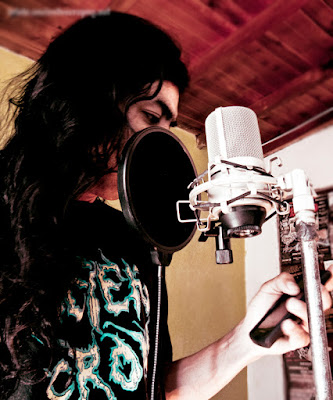 Colombian artist IvancientJ preparing for vocal recording, Colombian rock bands