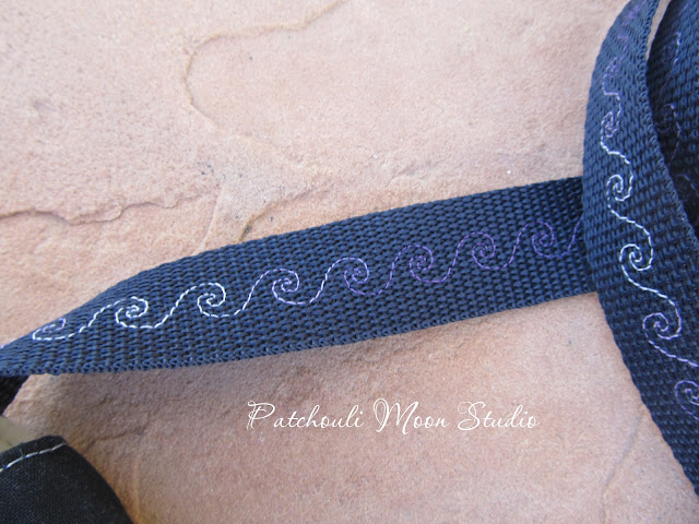 Closeup of decorative stitched webbing strap
