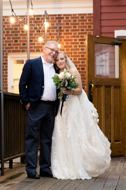 The bride and groom met in college, and have been together for three and a half years.  Maggie said that walking down the aisle towards Jordan was the best part of the day, knowing that they were surrounded by the love and support of friends and family.  She said, "As I walked towards him, Jordan and I were both tearing up and we couldn't look away from each other."  Jordan said that since he was "anxious all day, to the point of feeling sick," the first look was the most memorable part of the day.  He said, "The moment I saw Maggie, I felt 100% relieved, and it made the hours before the ceremony so much more enjoyable."    The Festivities Event Center in El Reno, OK, was the perfect wedding backdrop, with 10' windows, a whole second floor to get ready in, and a romantic setting for the outdoor nuptial.  The bride looked "drop-dead gorgeous" in her lace-embroidered, strapless, wedding gown, followed by her bridesmaids, dressed in individually designed gowns in soft hues of dusty rose.  Each bridesmaid had a spring floral bouquet, similar to the bride's bouquet of pastel pink roses and lilies.    After the couple exchanged wedding vows, pictures of the family and wedding party were taken, and it was time to celebrate!  First dances came next, then guests were invited to enjoy a Mexican buffet.  Dessert included the gorgeous wedding cake, chocolate groom's cake, and assorted, homemade cookies and pastries.  The evening came to a close as the guests sent the star-gazed couple off with sparklers!  The newly married couple escaped to Cozumel and Yucatan Progreso for their honeymoon.  