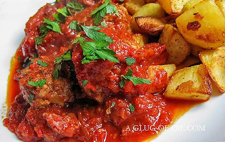 Meatballs in tomato and chorizo sauce with crispy potatoes.