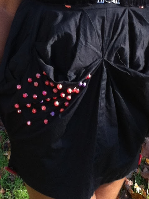 black dress with red beads oversize red buttons