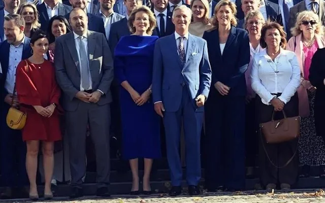 Queen Mathilde wore a royal blue midi dress by Natan. King Philippe hosted a reception for mayors of cities and municipalities